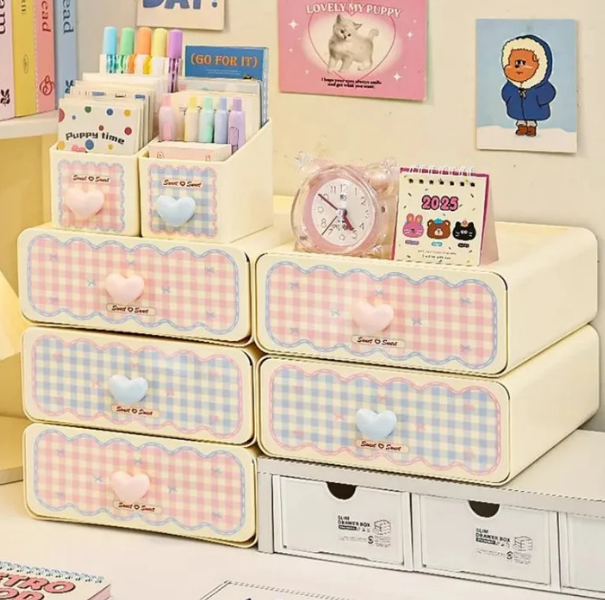 Pastel gingham desktop stationery organizer in pink and white grid pattern with multiple pen and supply slots
