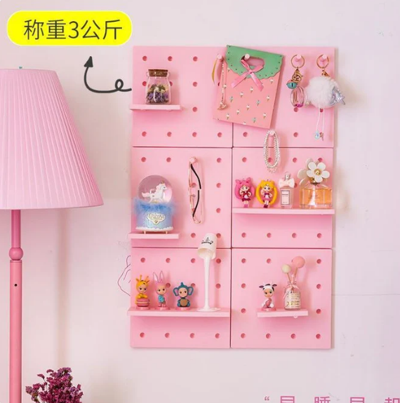 White wall peg board and shelf kit for small room desk organisation with hooks and a display shelf